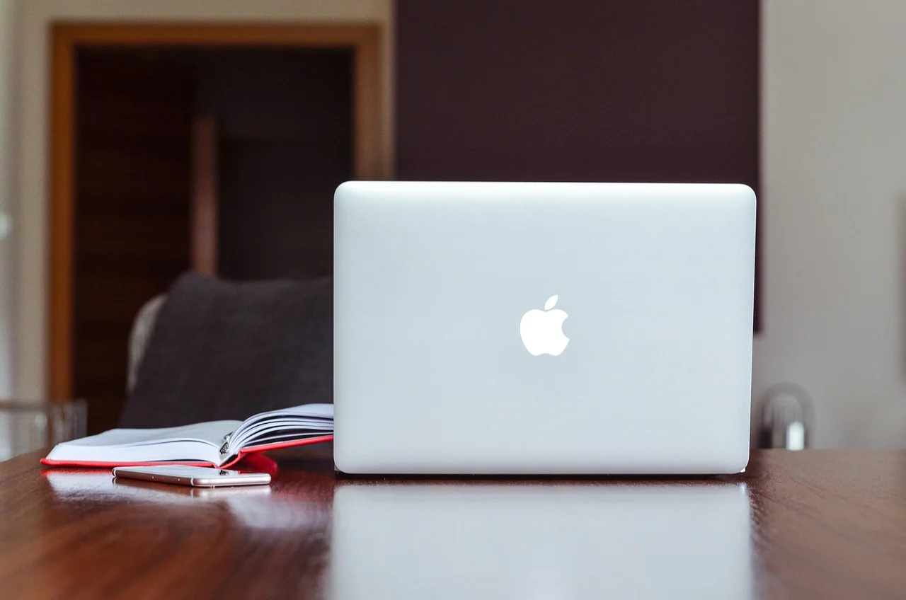 Developer working on accessible and usable website design on laptop