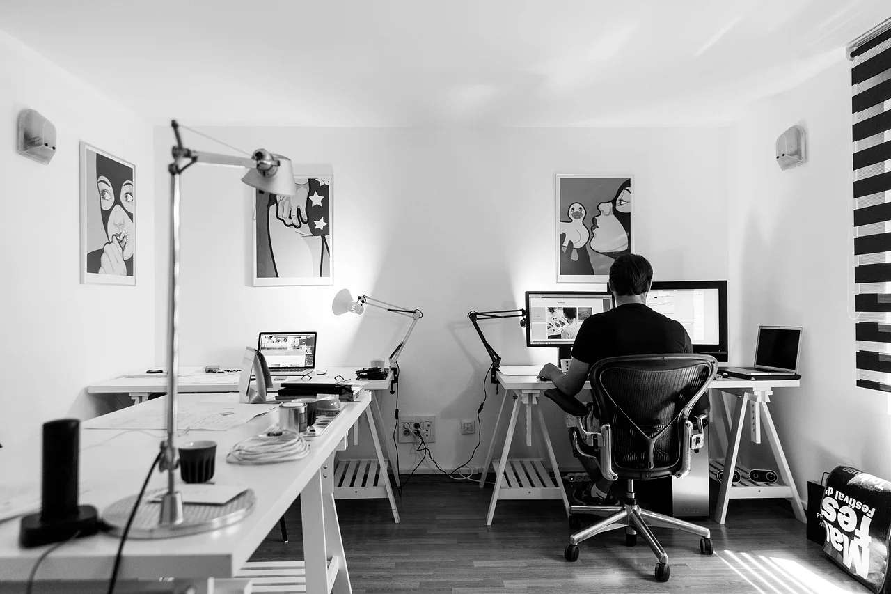 Developer working on laptop with accessibility testing tools open on screen