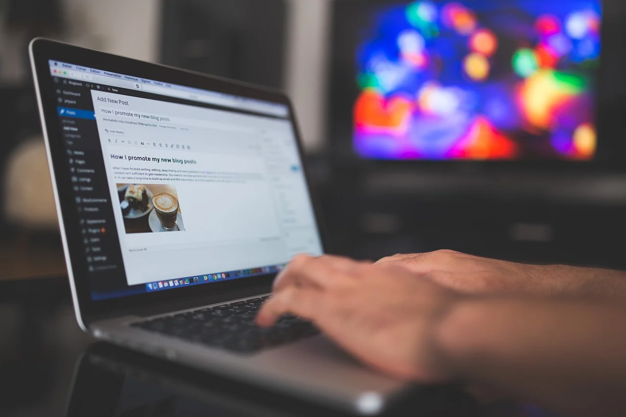 A person using a keyboard to tab through a website navigation, with skip link visible